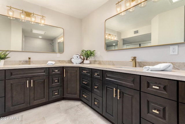 bathroom featuring tile patterned flooring and vanity