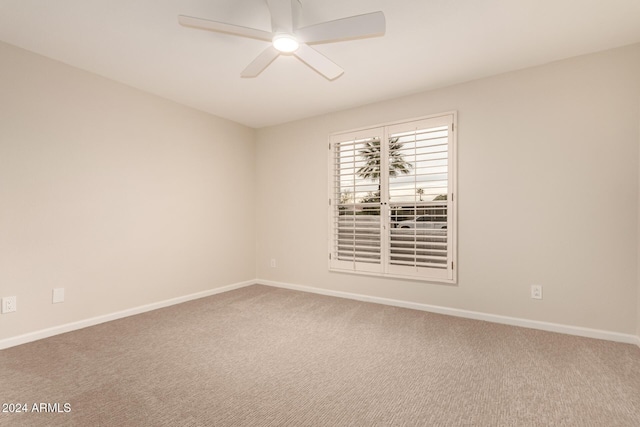 unfurnished room featuring carpet and ceiling fan