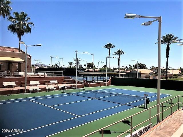 view of sport court featuring basketball hoop