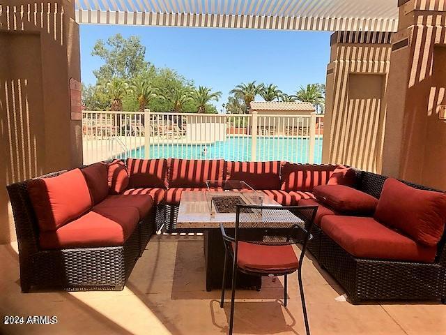 view of patio / terrace with a fenced in pool and outdoor lounge area