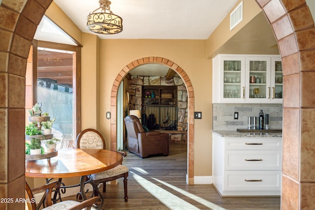 dining room featuring dark hardwood / wood-style flooring