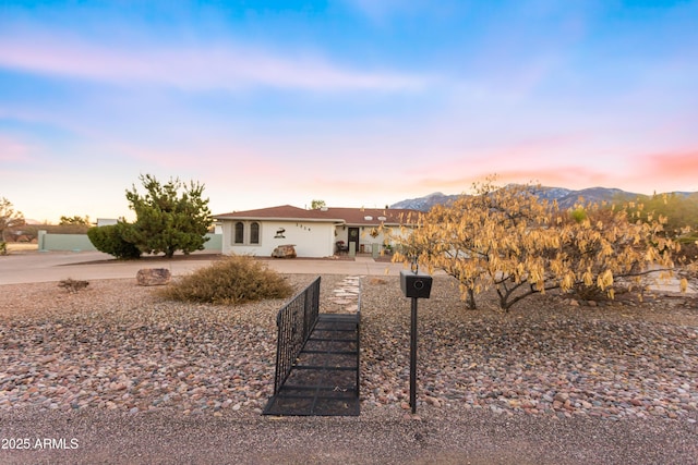 ranch-style home featuring a mountain view