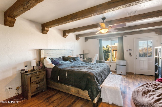 bedroom featuring beamed ceiling, ceiling fan, and dark wood-type flooring