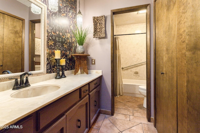 full bathroom with tile patterned floors, vanity, shower / tub combo, and toilet