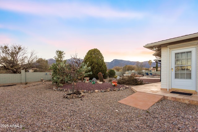 yard at dusk with a mountain view