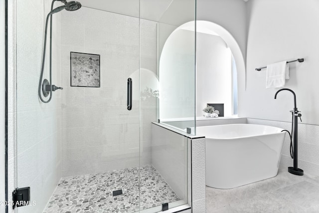 bathroom with independent shower and bath