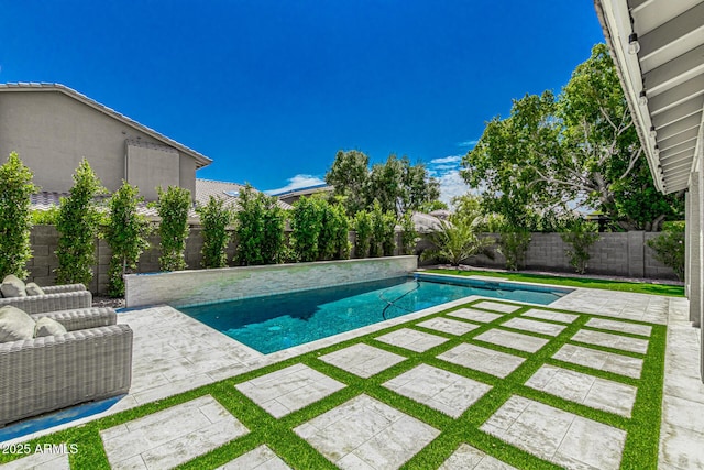 view of pool featuring a patio area