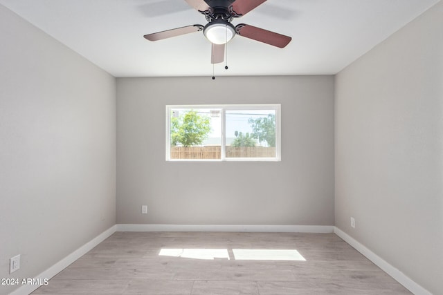 spare room with ceiling fan and light hardwood / wood-style floors