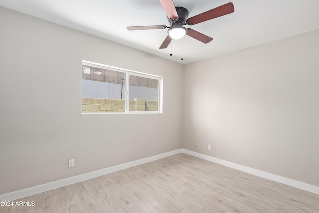 unfurnished room with ceiling fan and light hardwood / wood-style floors