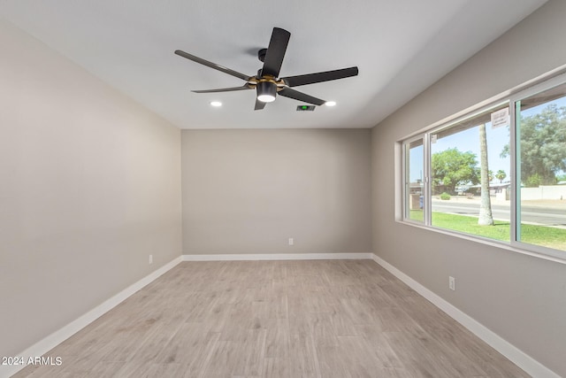 empty room featuring ceiling fan and light wood-type flooring