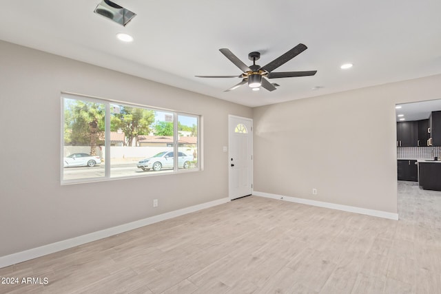 interior space featuring ceiling fan and light wood-type flooring