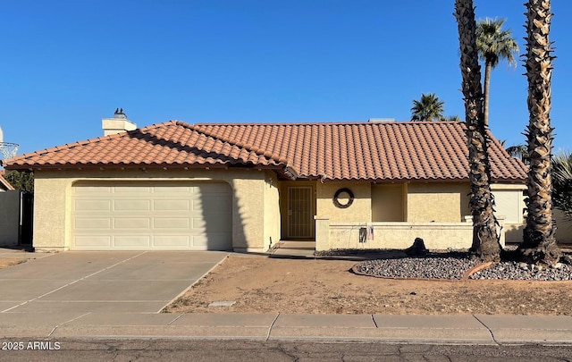 mediterranean / spanish home featuring a chimney, stucco siding, concrete driveway, a garage, and a tile roof