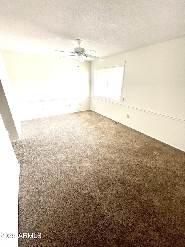 4330 E Beck Ln, Phoenix, AZ 85032 - empty room featuring a textured ceiling, carpet, and a ceiling fan