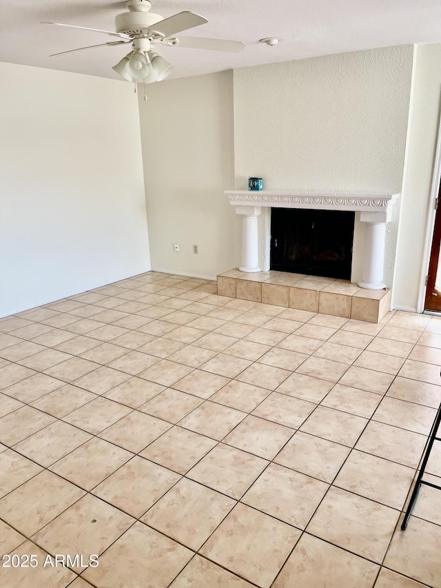 4330 E Beck Ln, Phoenix, AZ 85032 - unfurnished living room featuring a ceiling fan and a tile fireplace