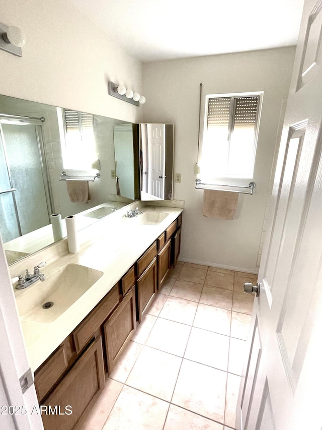 4330 E Beck Ln, Phoenix, AZ 85032 - bathroom featuring double vanity, a shower with shower door, a sink, and tile patterned floors