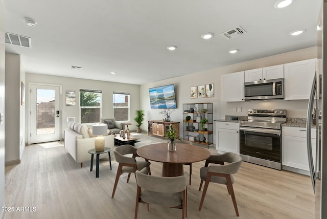 459 Brandeis Dr, Morristown, AZ 85342 - dining space featuring light wood-style floors, visible vents, and recessed lighting