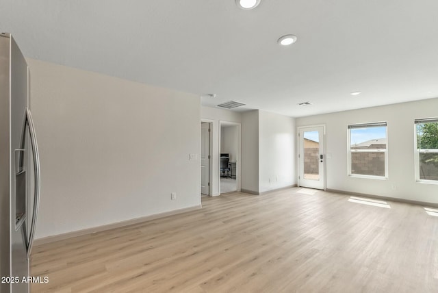 459 Brandeis Dr, Morristown, AZ 85342 - unfurnished living room with recessed lighting, visible vents, light wood finished floors, and baseboards
