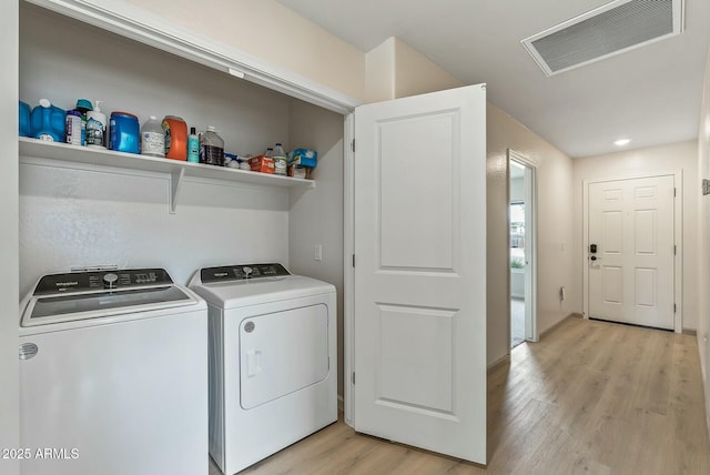 459 Brandeis Dr, Morristown, AZ 85342 - laundry room with independent washer and dryer, light wood-style floors, visible vents, and laundry area