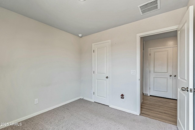 459 Brandeis Dr, Morristown, AZ 85342 - unfurnished bedroom featuring carpet floors, visible vents, and baseboards