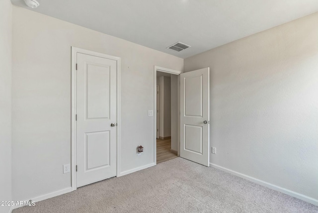 459 Brandeis Dr, Morristown, AZ 85342 - unfurnished bedroom with baseboards, visible vents, and carpet flooring