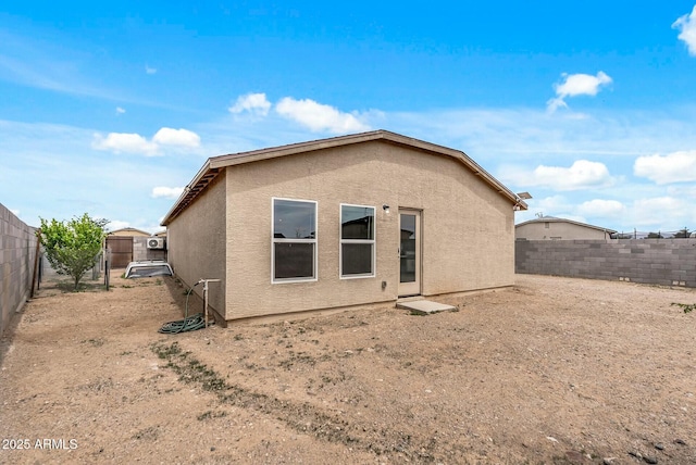459 Brandeis Dr, Morristown, AZ 85342 - rear view of house with stucco siding and a fenced backyard
