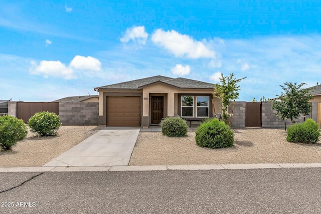 459 Brandeis Dr, Morristown, AZ 85342 - ranch-style house with a gate, fence, stucco siding, an attached garage, and driveway