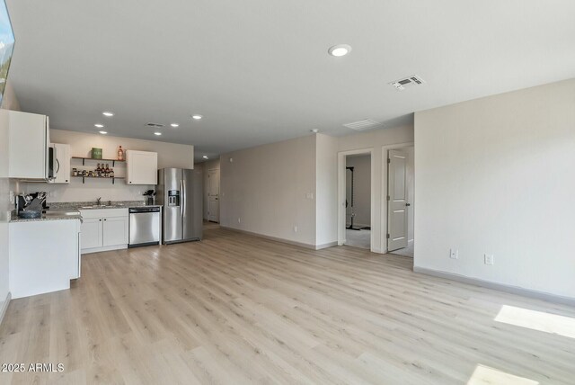 459 Brandeis Dr, Morristown, AZ 85342 - kitchen featuring appliances with stainless steel finishes, open shelves, light wood-style floors, and recessed lighting