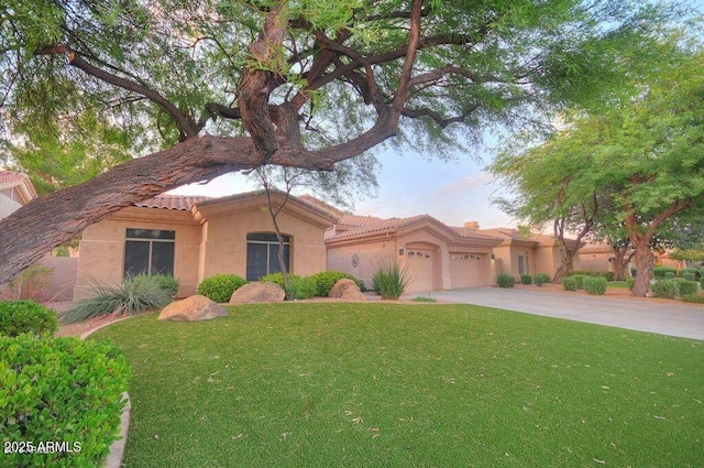 8036 E Mercer Ln, Scottsdale, AZ 85260 - view of front of property with an attached garage, a tiled roof, stucco siding, and a front yard