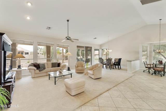 tiled living room with ceiling fan and lofted ceiling