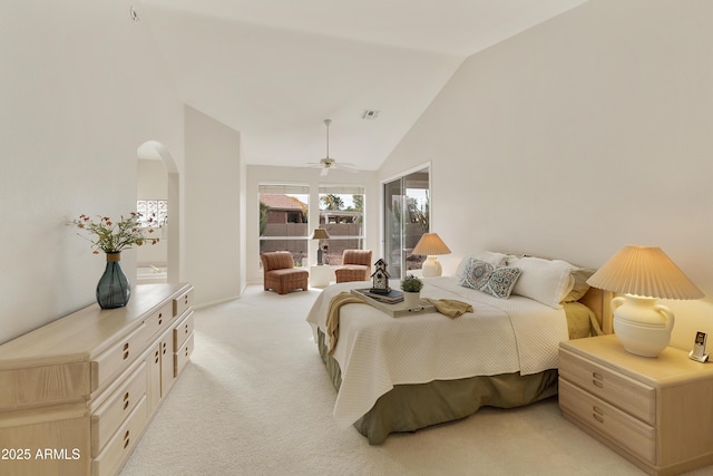 bedroom featuring light carpet and vaulted ceiling