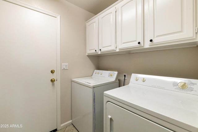 clothes washing area featuring light tile patterned floors, cabinets, and independent washer and dryer