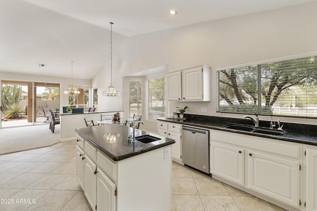 kitchen with dishwasher, pendant lighting, white cabinetry, and sink