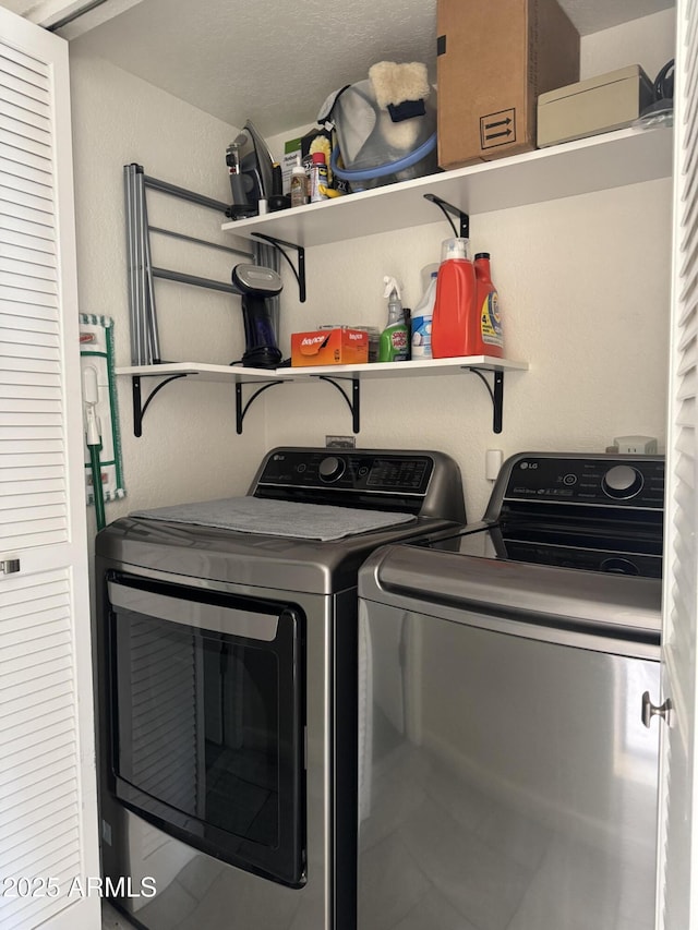 washroom with laundry area and independent washer and dryer