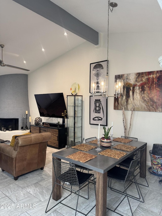 dining space with vaulted ceiling with beams and recessed lighting