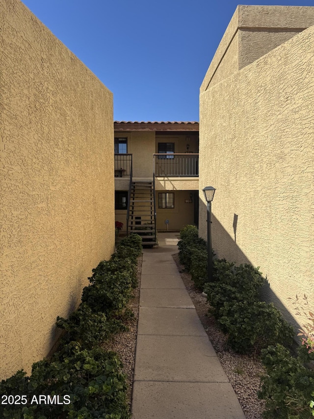 view of property's community featuring stairs