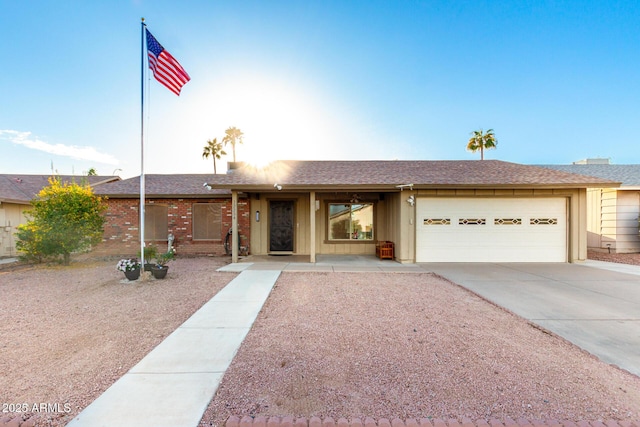 ranch-style house featuring a garage