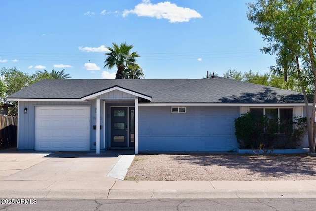 7635 E Verde Ln, Scottsdale, AZ 85251 - ranch-style home with driveway, a shingled roof, and an attached garage