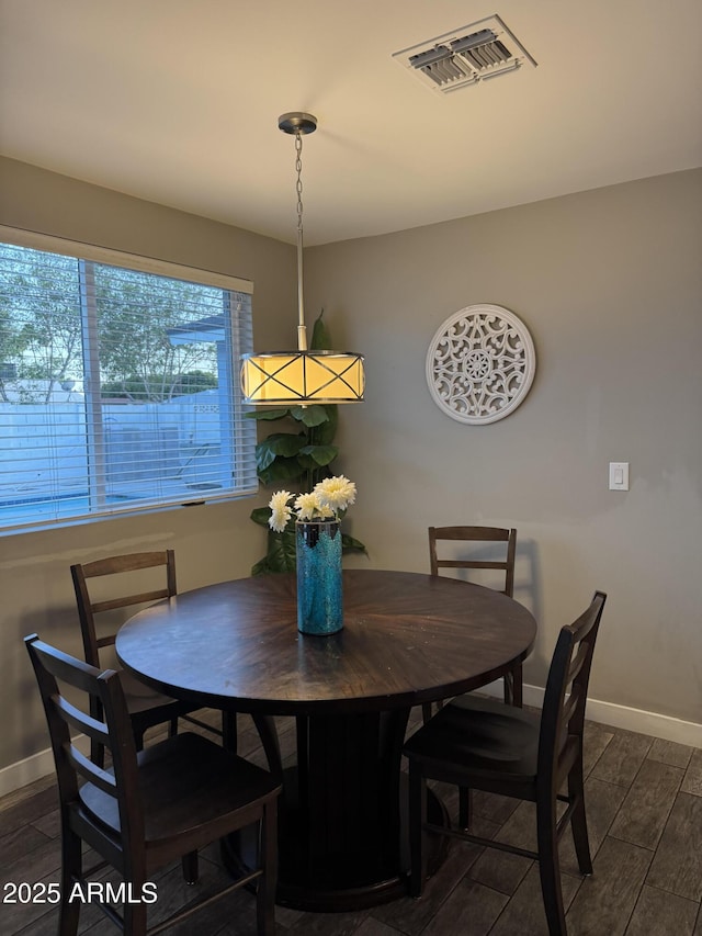 7635 E Verde Ln, Scottsdale, AZ 85251 - dining area with dark wood-type flooring, visible vents, and baseboards