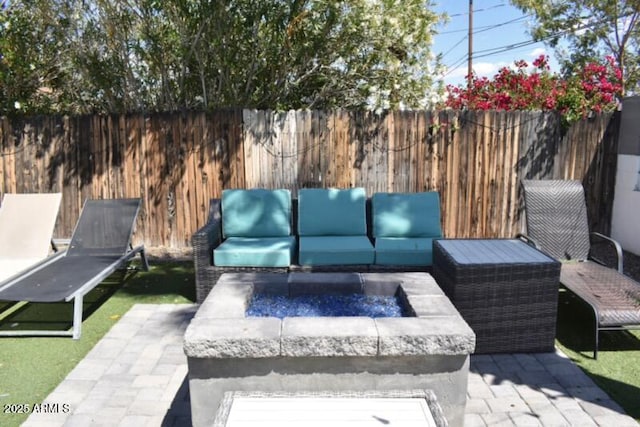 7635 E Verde Ln, Scottsdale, AZ 85251 - view of patio / terrace with fence and an outdoor living space with a fire pit