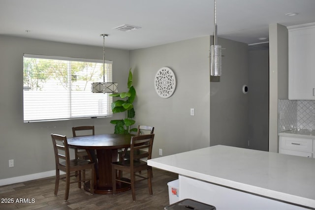 7635 E Verde Ln, Scottsdale, AZ 85251 - dining room with baseboards, visible vents, and dark wood-type flooring