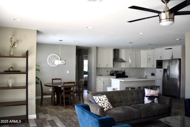 7635 E Verde Ln, Scottsdale, AZ 85251 - living area featuring recessed lighting, a ceiling fan, baseboards, and dark wood finished floors