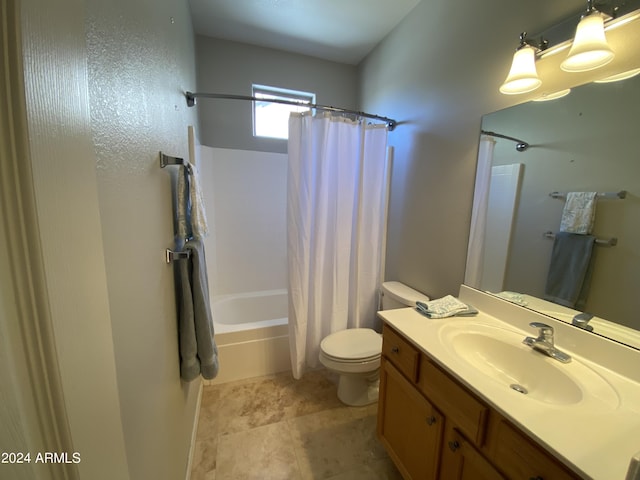 full bathroom with tile patterned floors, toilet, vanity, and shower / tub combo