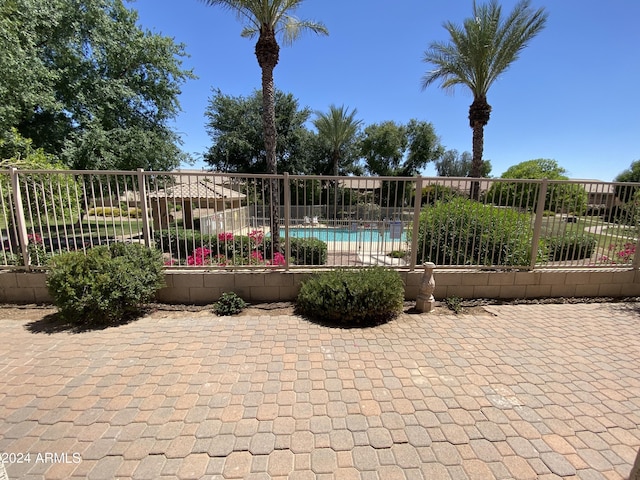 view of swimming pool with a fenced in pool and fence