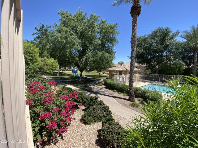 view of yard with a fenced in pool and a gazebo