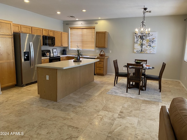 kitchen featuring visible vents, black appliances, a kitchen island, an inviting chandelier, and light countertops