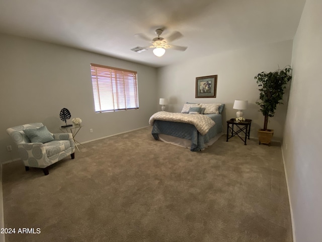 carpeted bedroom with baseboards, visible vents, and ceiling fan