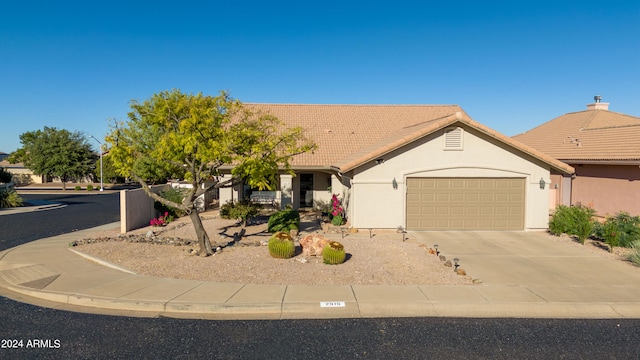 ranch-style house featuring a garage