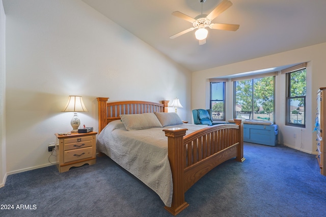 carpeted bedroom featuring vaulted ceiling and ceiling fan