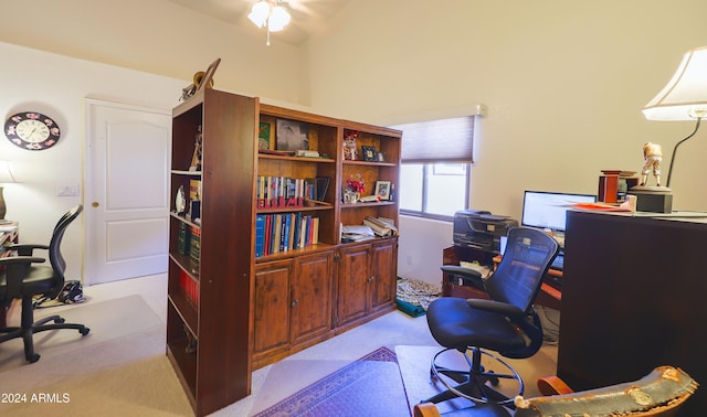 office area with light carpet, ceiling fan, and vaulted ceiling