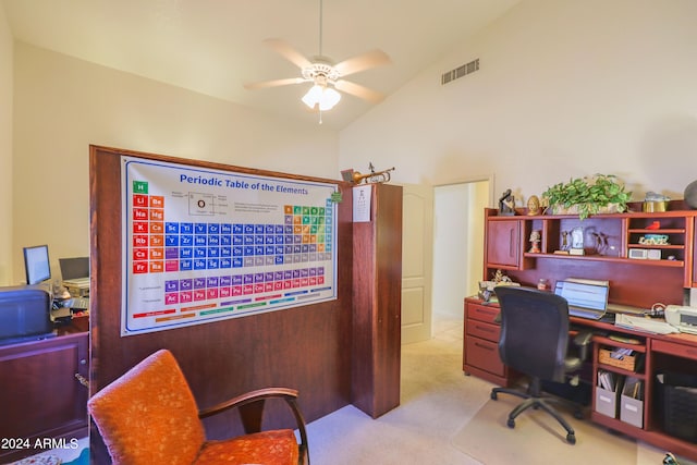 carpeted home office with high vaulted ceiling and ceiling fan